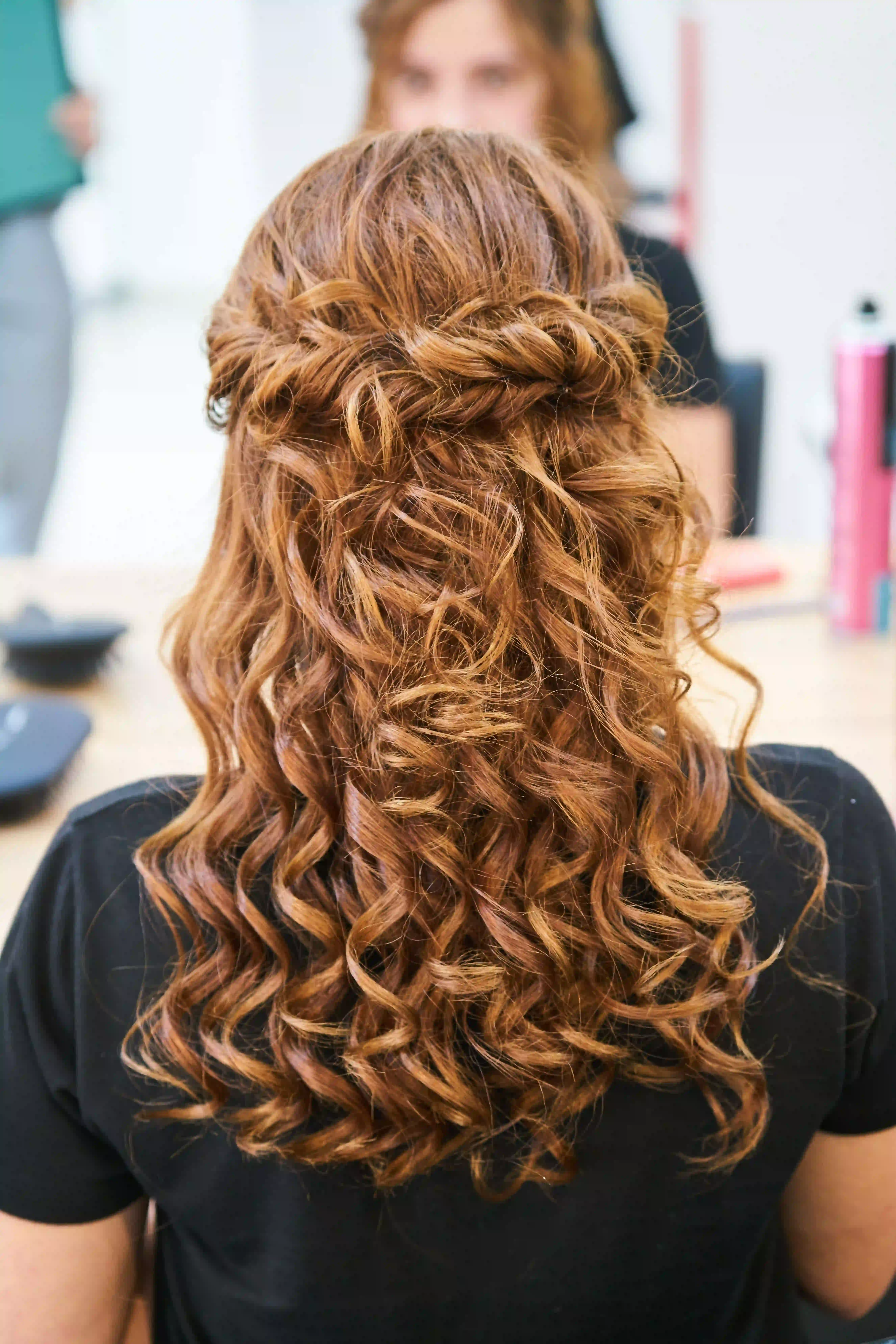 Finished copper curls in a salon chair